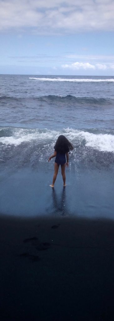 Girl at Punaluu Black Sands Beach